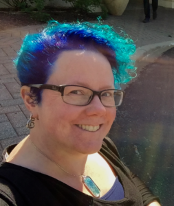 Jennifer Koerber headshot - blue hair
